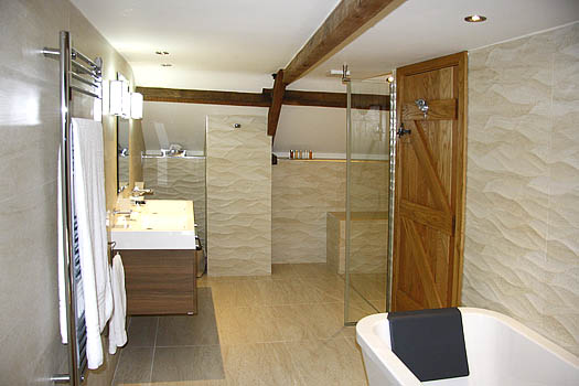 Bathroom at The Coach with double-ended bath and walk-in shower