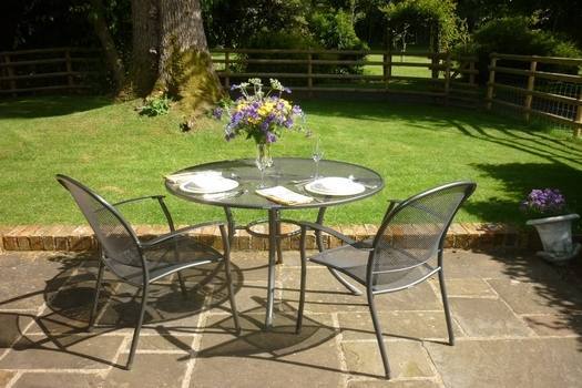 The Laundry's secluded walled garden framed by centuries-old stone walls