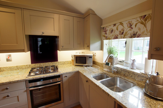 Country kitchen and dining space inside The Cottage
